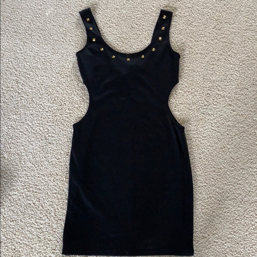 Black dress with gold studs.